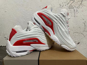 Pair of white sneakers with red side accents, shown from multiple angles