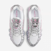 Top view of white and pink Nike Shox TL-style sneakers with lace-up fronts.