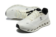 Pair of white On Cloudmonster 3 sneakers shown from above and at an angle.