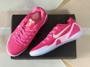Top-down three-quarter view showing the pink uppers, laces, tongue details, and translucent soles.