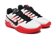 Pair of white basketball shoes with black laces and red accents, shown at an angle.