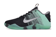 Side profile of a mint green and black lace-up basketball shoe