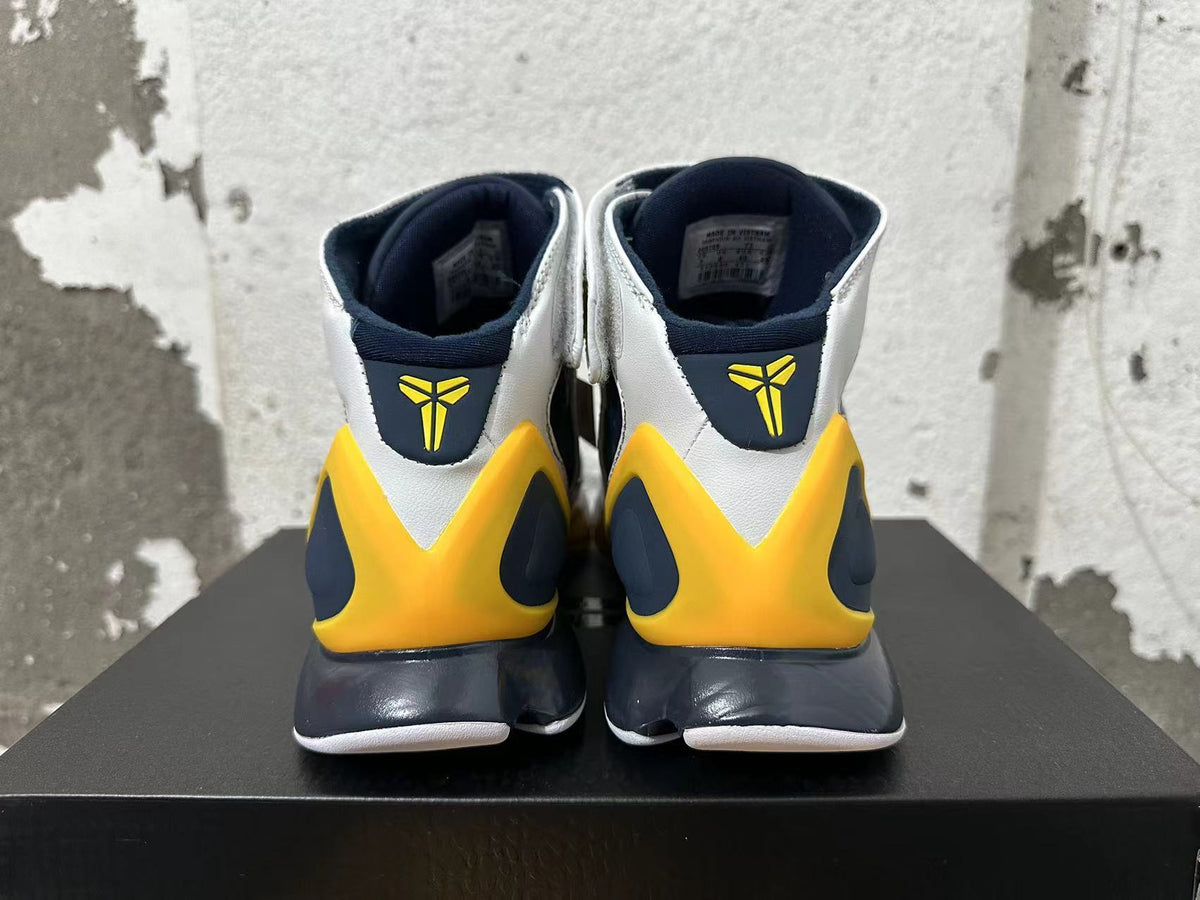 Rear view of Nike Kobe 2K5 high-top shoes in white, navy blue, and yellow.