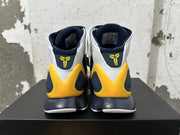 Rear view of Nike Kobe 2K5 high-top shoes in white, navy blue, and yellow.
