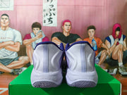 Rear view of purple Nike basketball shoes showing light gray heels and speckled midsoles.