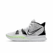 White Nike Kyrie 7 basketball sneaker with black Swoosh branding, neon green outsole accents, and black heel details.