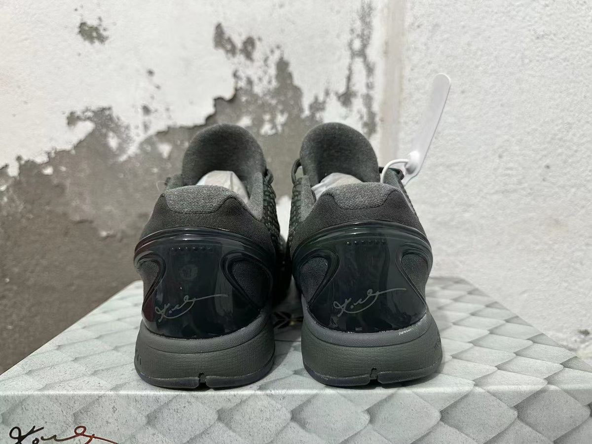 Rear view of the dark Nike Kobe 6 shoes showing heel details and signature graphics