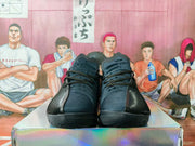 Front view of paired black Nike GT basketball sneakers showing the padded tongues, black laces, and rounded toe boxes.