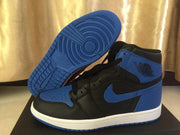 Side profile of a black and royal blue high-top sneaker with the blue outsole lifted to show its circular tread pattern.