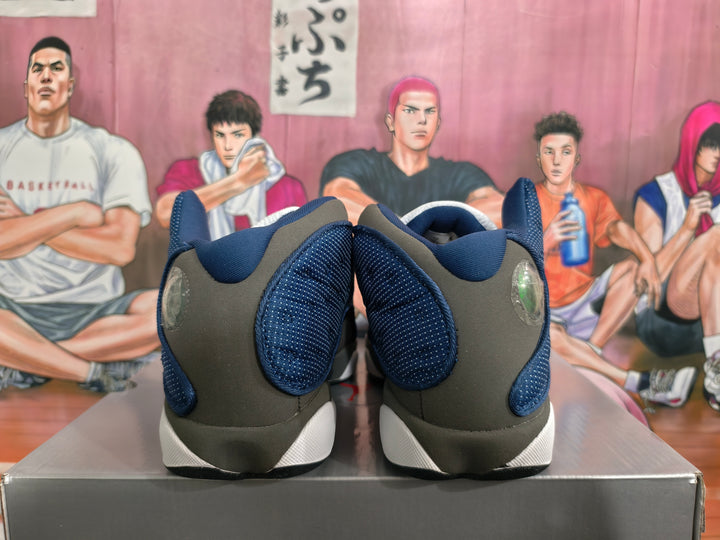Rear view of navy, charcoal, and white Jordan basketball sneakers