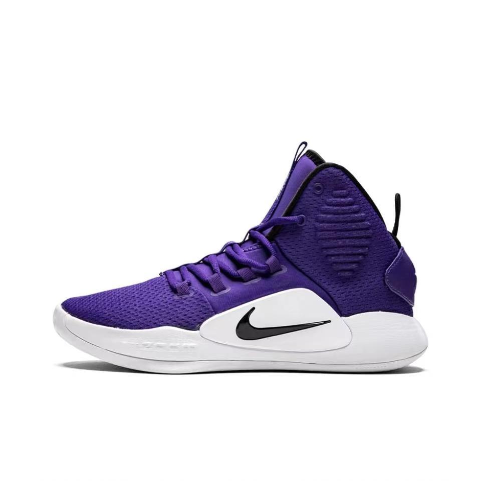 Purple Nike high-top basketball shoe with a white midsole and black Swoosh, shown from the side.