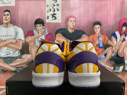 Rear view of yellow and purple Nike basketball shoes with white midsoles