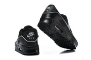 Rear and outsole views of black Nike Air Max 90 sneakers.