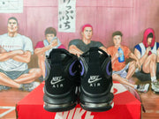 Rear view showing embroidered Nike Air branding, padded collars, purple heel details, and translucent heel units.