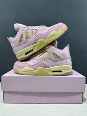 Stacked display of the pink sneakers showing the side panels, translucent wings, pale yellow midsoles, and pink outsole accents.