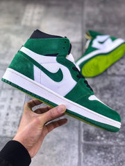 Side view showing the green and white upper, black laces, and white midsole.