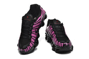 Front views of the purple and black Nike Shox TL sneakers.