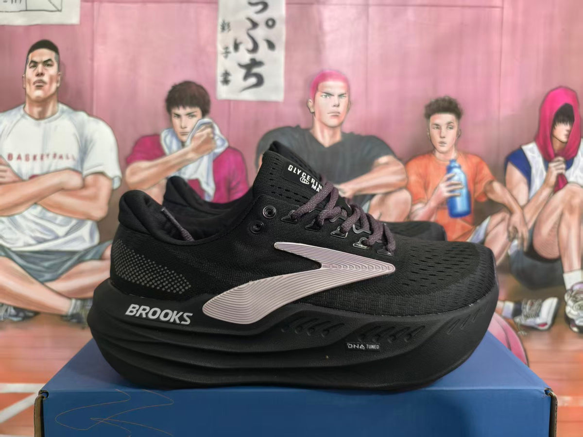 Black Brooks running shoe shown from the side with dark laces and a light-colored side logo accent.