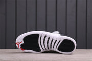Bottom view showing the white outsole with black traction sections and red heel branding.