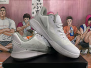 Angled side view showing the Nike Swoosh, perforated side panel, layered upper, and textured outsole.