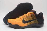 Nike Kobe 11 shoe beside its black outsole