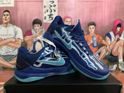 Three-quarter view of two dark blue basketball sneakers displaying graphic side panels, light blue accents, and translucent outsoles.