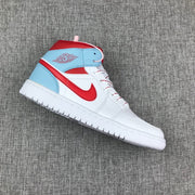 Side view of a white, ice blue, and red Jordan Air Jordan 1 Mid sneaker.