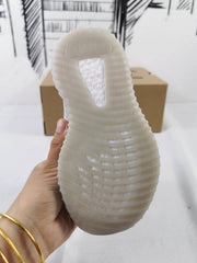 Close-up of the translucent ribbed outsole and textured tread.