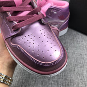 Close-up of the perforated toe box, burgundy laces, and layered stitching.