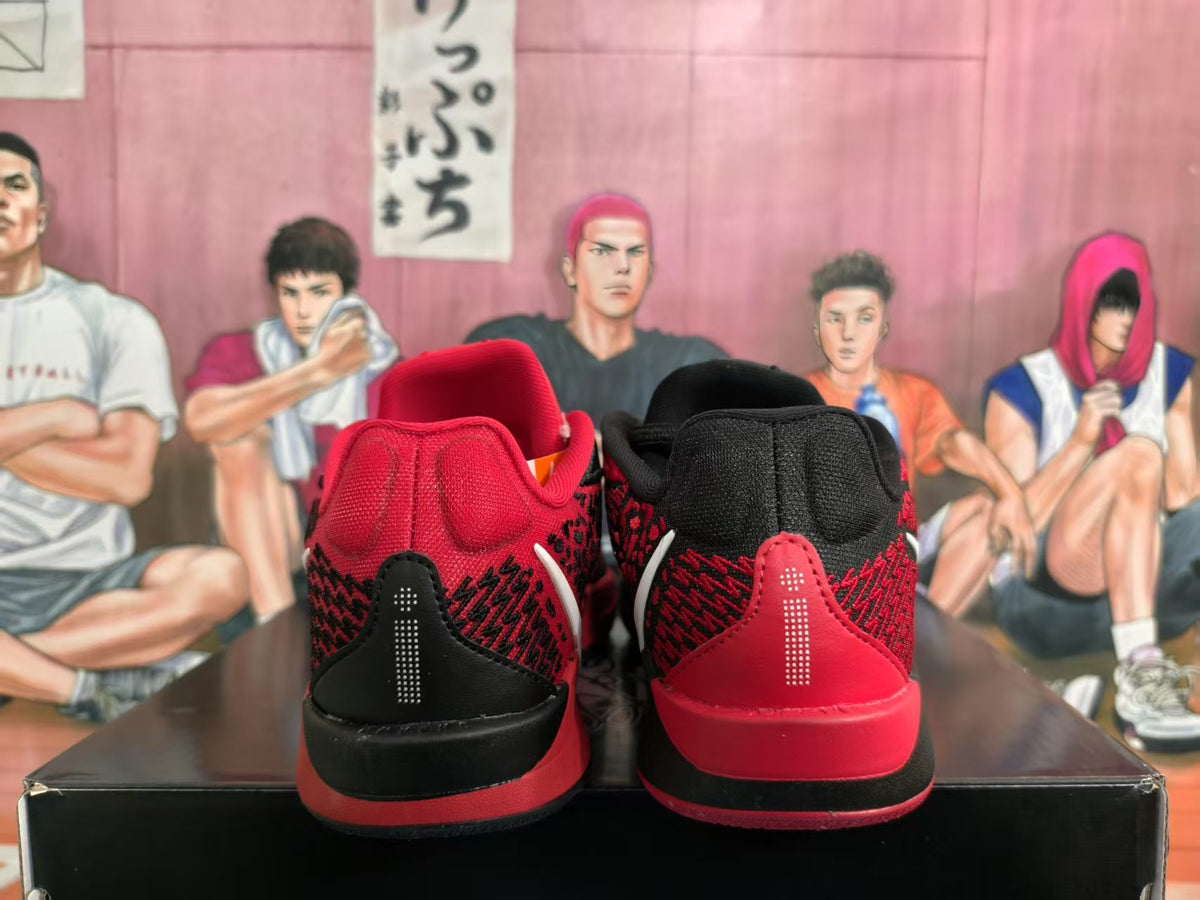 Rear view of red and black Nike basketball sneakers showing padded collars, patterned uppers, and contrasting heel panels.