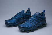 Pair of blue Nike Air VaporMax Plus TN-15 sneakers in a three-quarter view.
