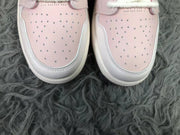 Close-up of the perforated pink toe boxes and white surrounding panels.