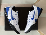 Top-down view of the pair highlighting the white uppers, blue Swooshes and black collars.
