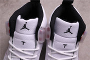 Top view showing black-lined collars, white tongues, and Jumpman tongue branding.