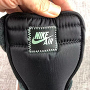 Close-up of the black tongue label with Nike Air text and a Swoosh logo.
