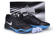 Black and blue Nike Sabrina 4 shoes displayed with a shoe box