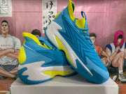 Angled view showing the textured side panels, white midsole sections, and blue outsole