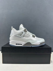 Side profile of a single grey Jordan Air Jordan 4 sneaker displayed on a black shoebox.