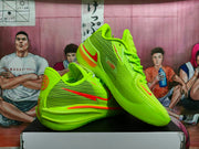 Angled view of the fluorescent green Nike basketball sneakers showing the side panels, heel details and outsole construction.