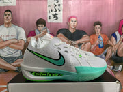 Side view highlighting the white upper, green Swoosh, ZoomX midsole, and translucent green outsole.