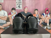 Rear view of the black Nike KD sneakers showing the ribbed heel sections and outsole traction.