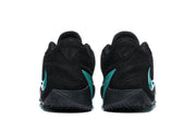 Rear view of the black basketball shoes showing green heel accents and patterned outsoles