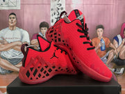 Angled view of the pair highlighting the red textured upper, black detailing, and open geometric side panels.