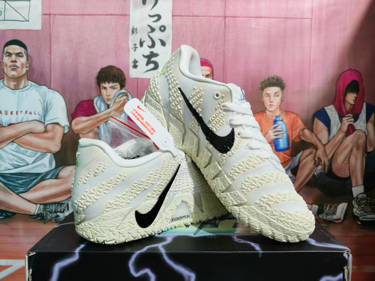 Pair of off-white Nike basketball sneakers with black Swooshes displayed on a shoebox.