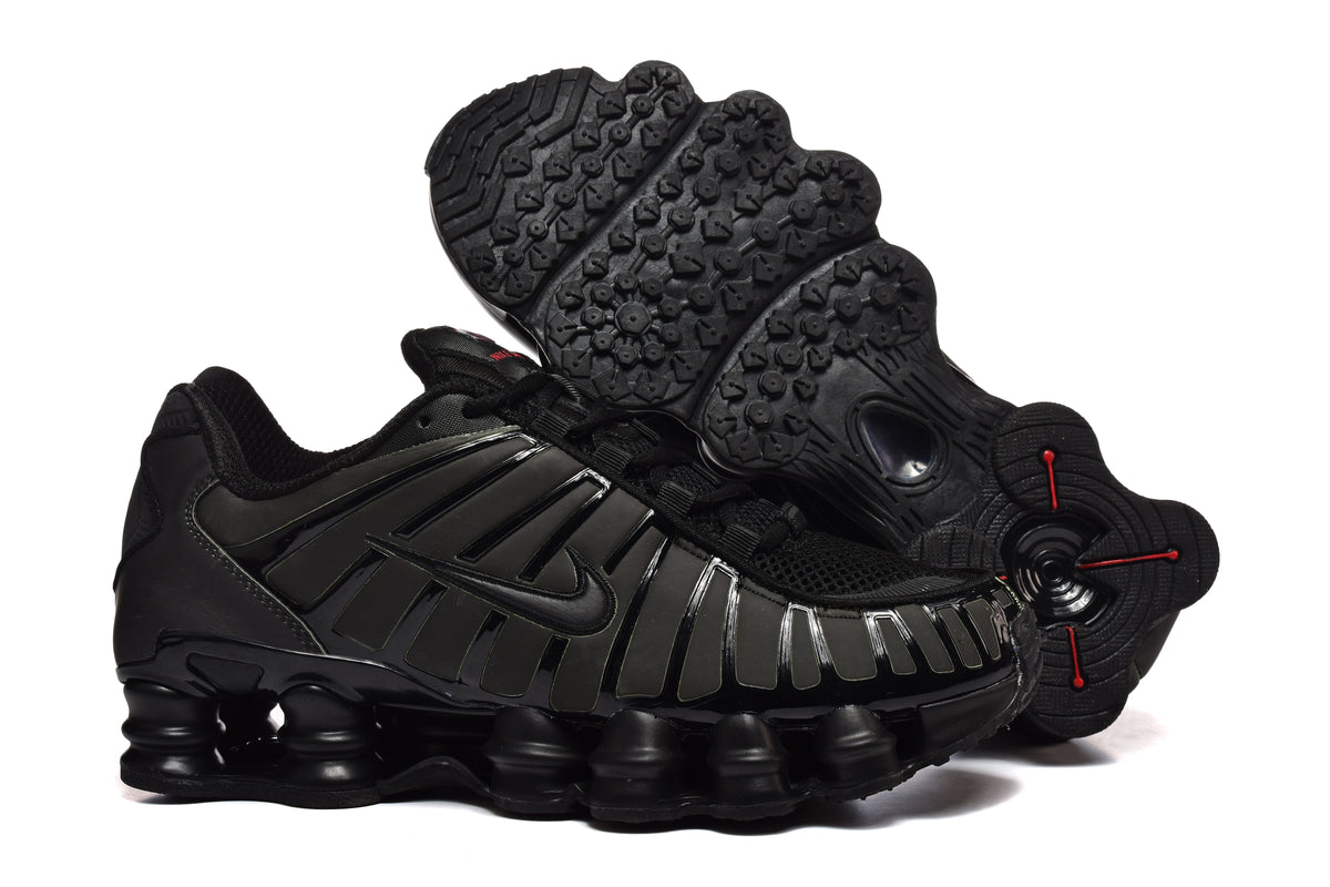 Black Nike Shox-style sneaker with a sculpted outsole, shown alongside its tread.