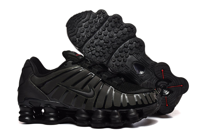 Black Nike Shox-style sneaker with a sculpted outsole, shown alongside its tread.