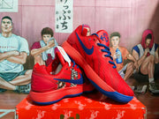 Angled view highlighting the side graphics, Nike Swoosh, padded collar, and layered ribbed midsole.