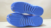 View of the blue rubber outsoles with herringbone tread and traction sections.