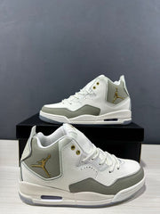 Close three-quarter view of the pair highlighting the layered upper panels, padded collars and gold-tone branding.