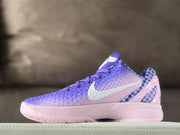 Opposite side profile showing the violet textured upper, light-colored Swoosh, checkerboard heel detail, and pink outsole.